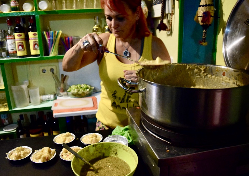 Dishing out the "Moqueca de Mandioca con Pesto" tapa at Maloka Bar Brasileiro in Lavapiés