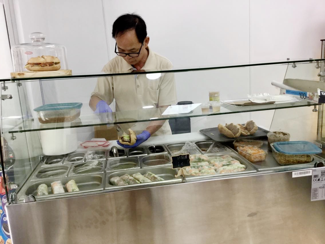 Juan assembling banh mi for hungry consumers