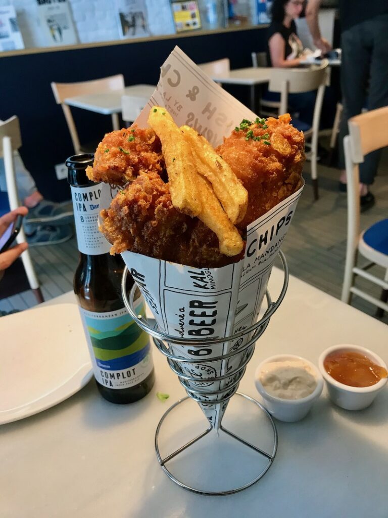 fish and chips served at The Fish & Chips Shop in Madrid's Chueca neighborhood, with an IPA beer